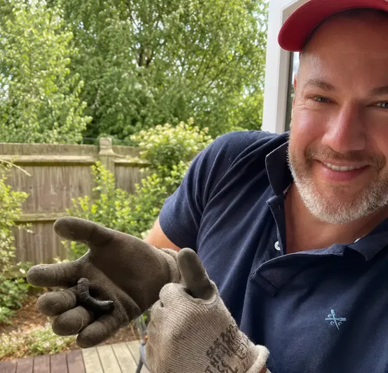The owner and founder of Hortus Viridis - Ian Thomson - holding a Elephant hawk-moth caterpillar (Deilephila elpenor).